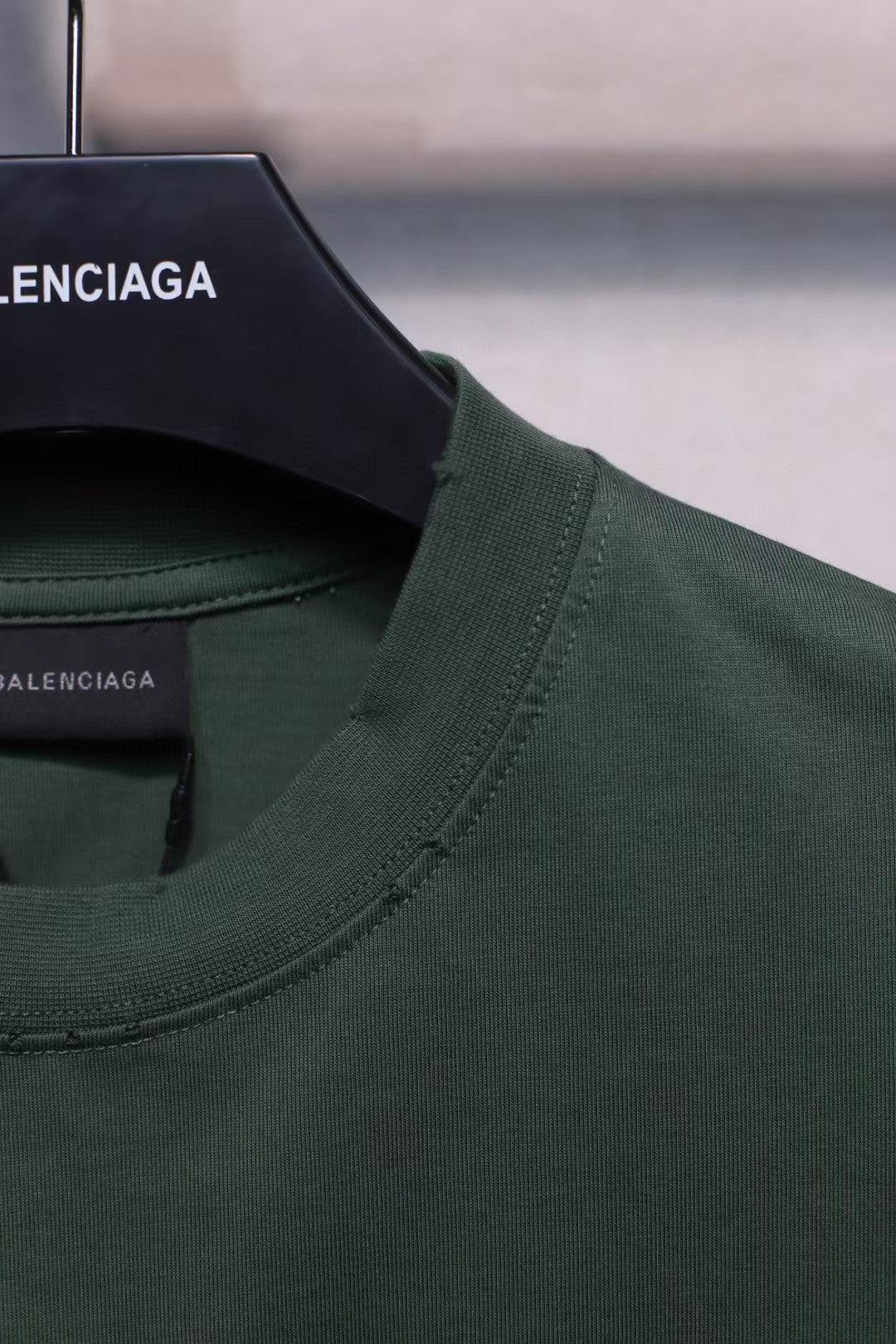 Short sleeved T-shirt with embossed paper tape