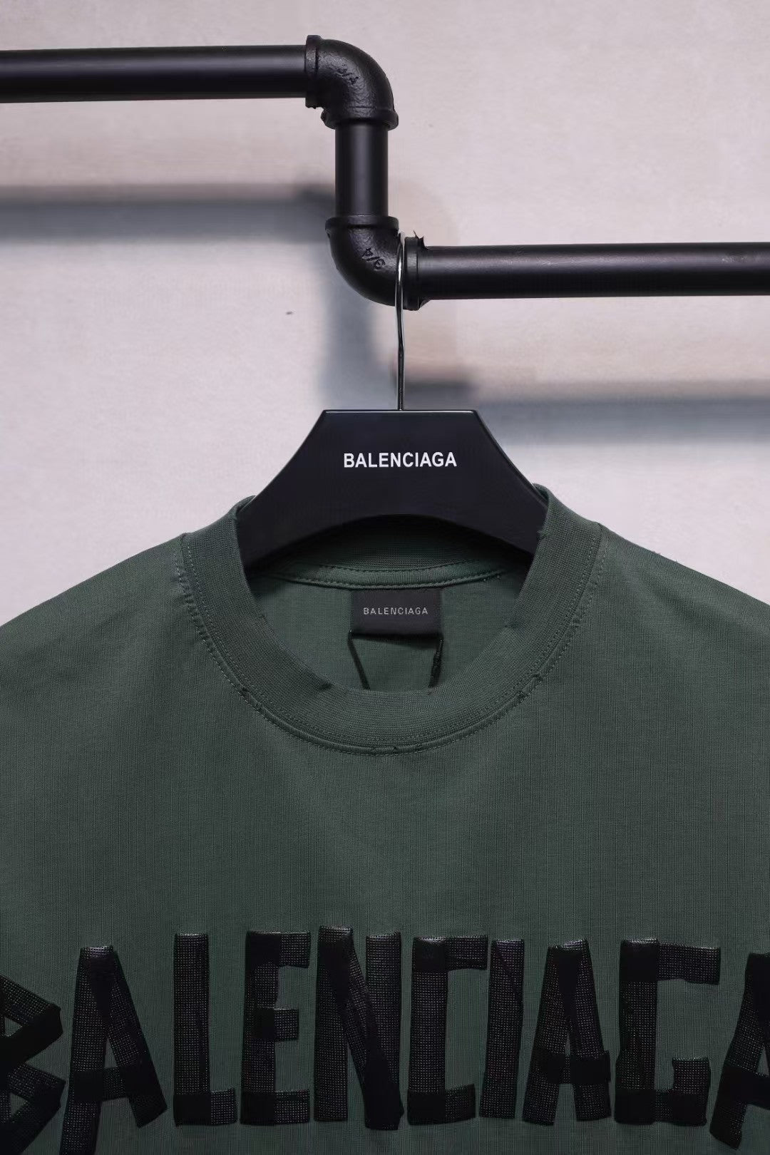 Short sleeved T-shirt with embossed paper tape