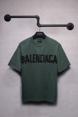 Short sleeved T-shirt with embossed paper tape