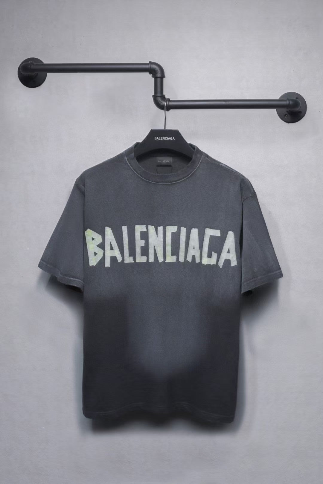 Short sleeved T-shirt with embossed paper tape