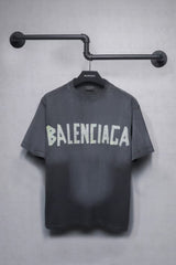 Short sleeved T-shirt with embossed paper tape