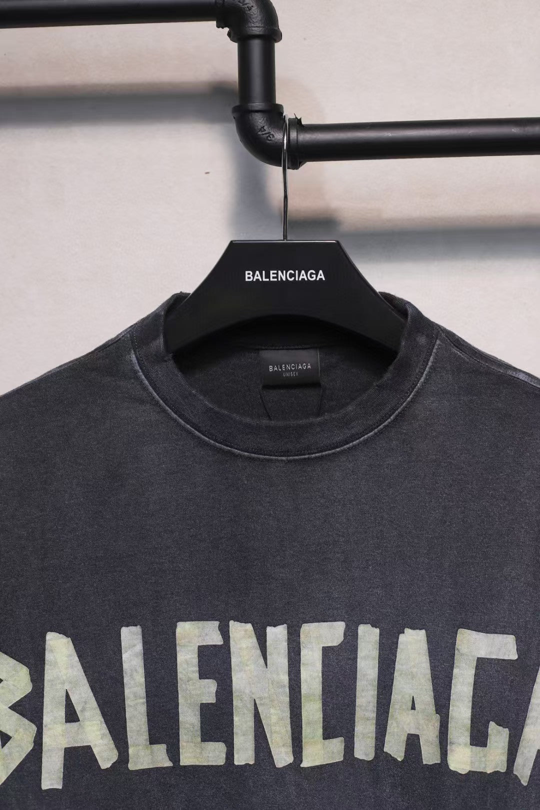 Short sleeved T-shirt with embossed paper tape
