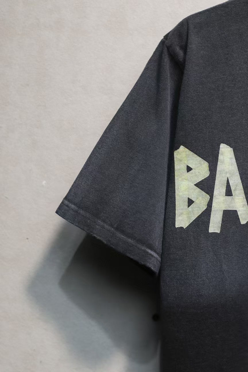 Short sleeved T-shirt with embossed paper tape