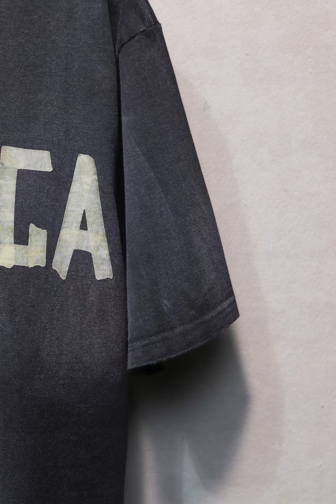 Short sleeved T-shirt with embossed paper tape