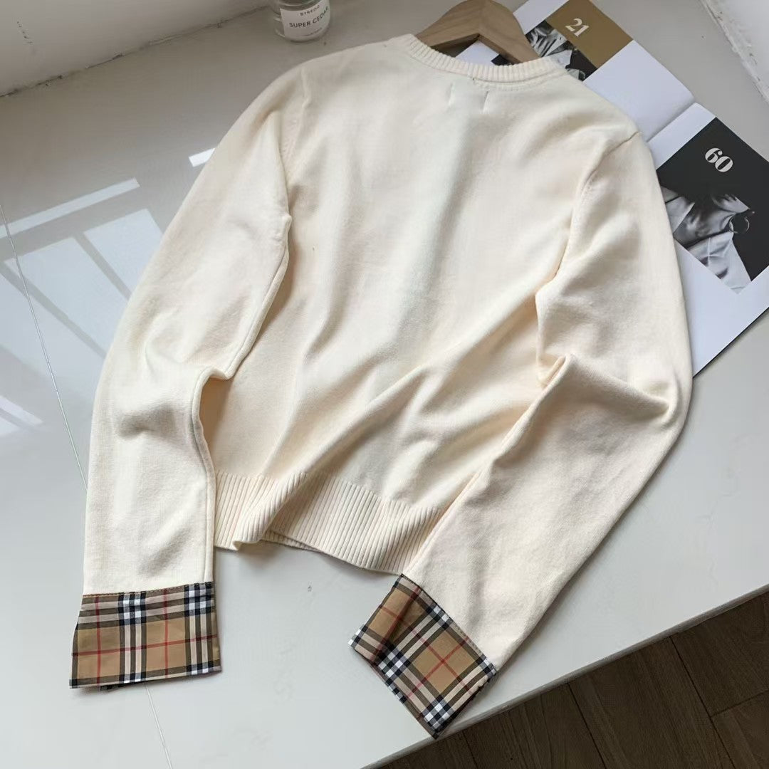 Embroidered long sleeved checkered knit sweater