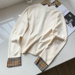 Embroidered long sleeved checkered knit sweater