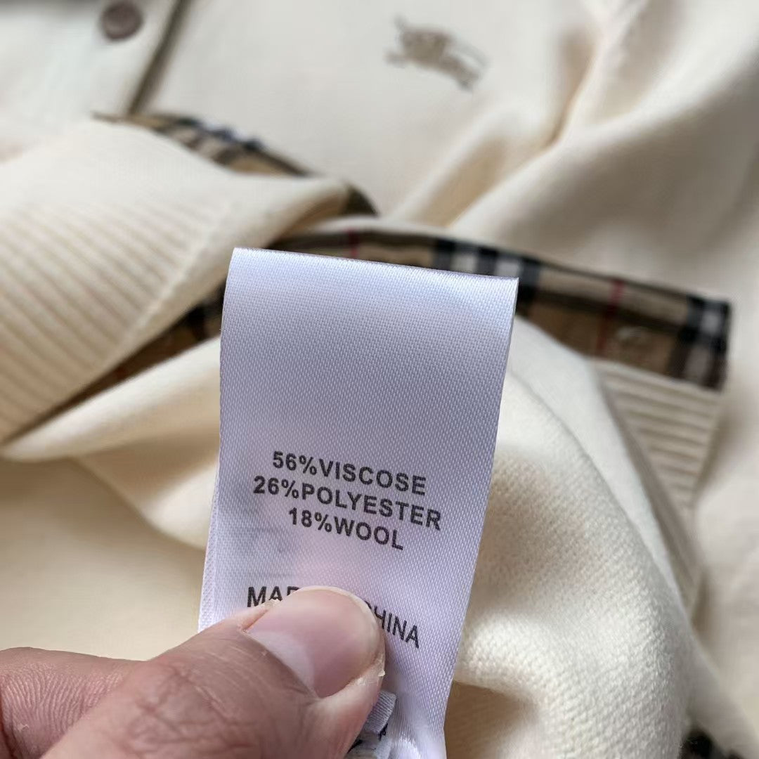 Embroidered long sleeved checkered knit sweater