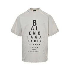 Eye chart knife cuts holes in short sleeves