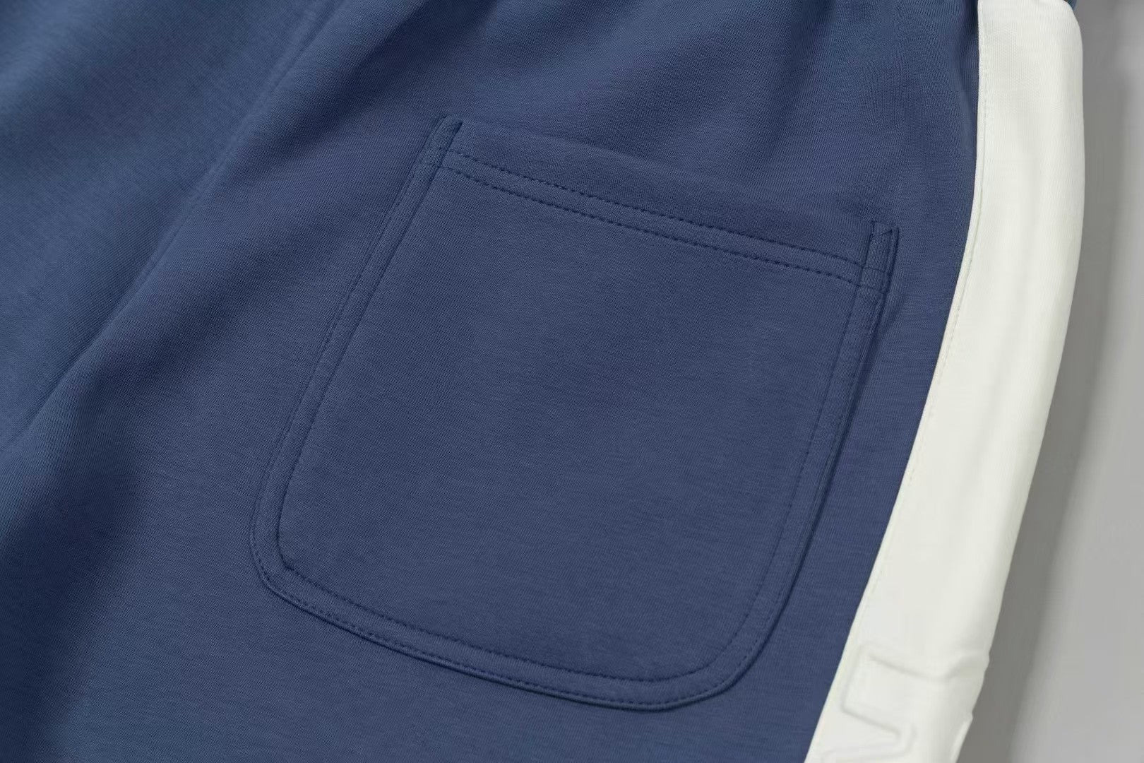Men's spliced three-dimensional shorts