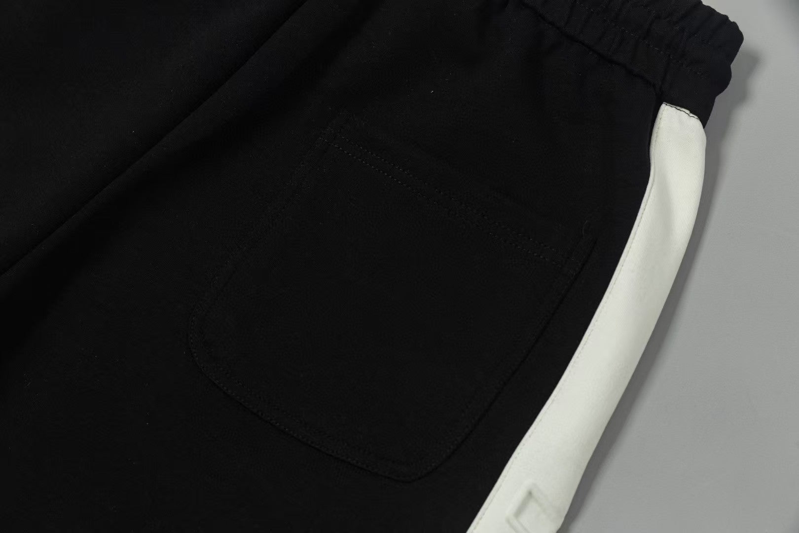Men's spliced three-dimensional shorts