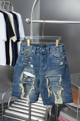 Wear and tear denim shorts with holes