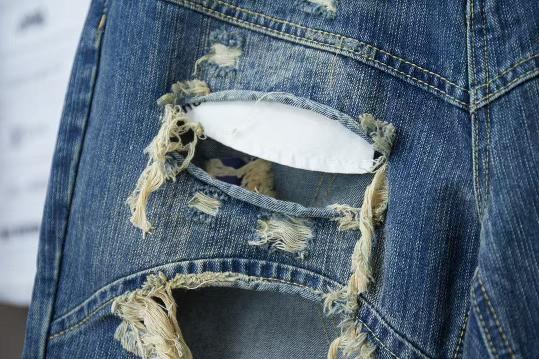 Wear and tear denim shorts with holes