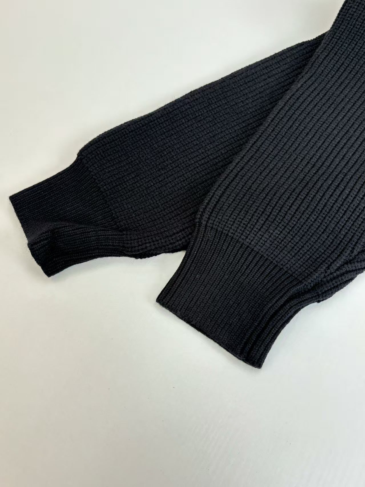 Knitted round neck sweater with armband