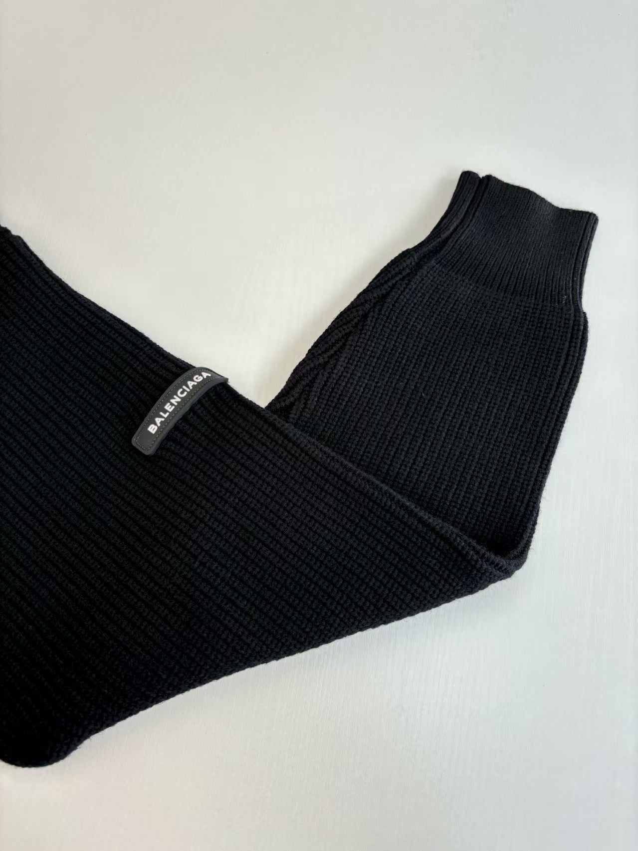 Knitted round neck sweater with armband