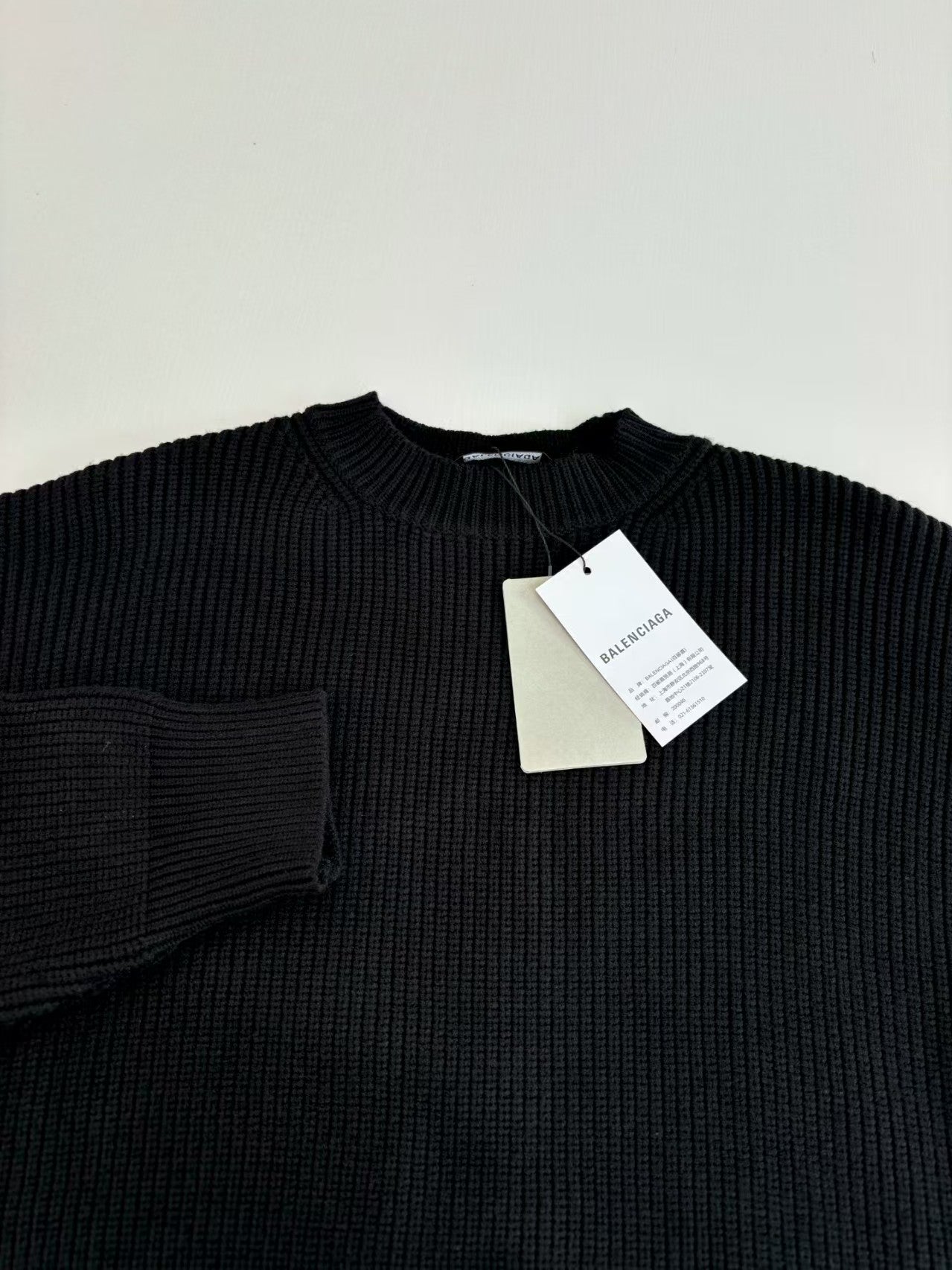 Knitted round neck sweater with armband