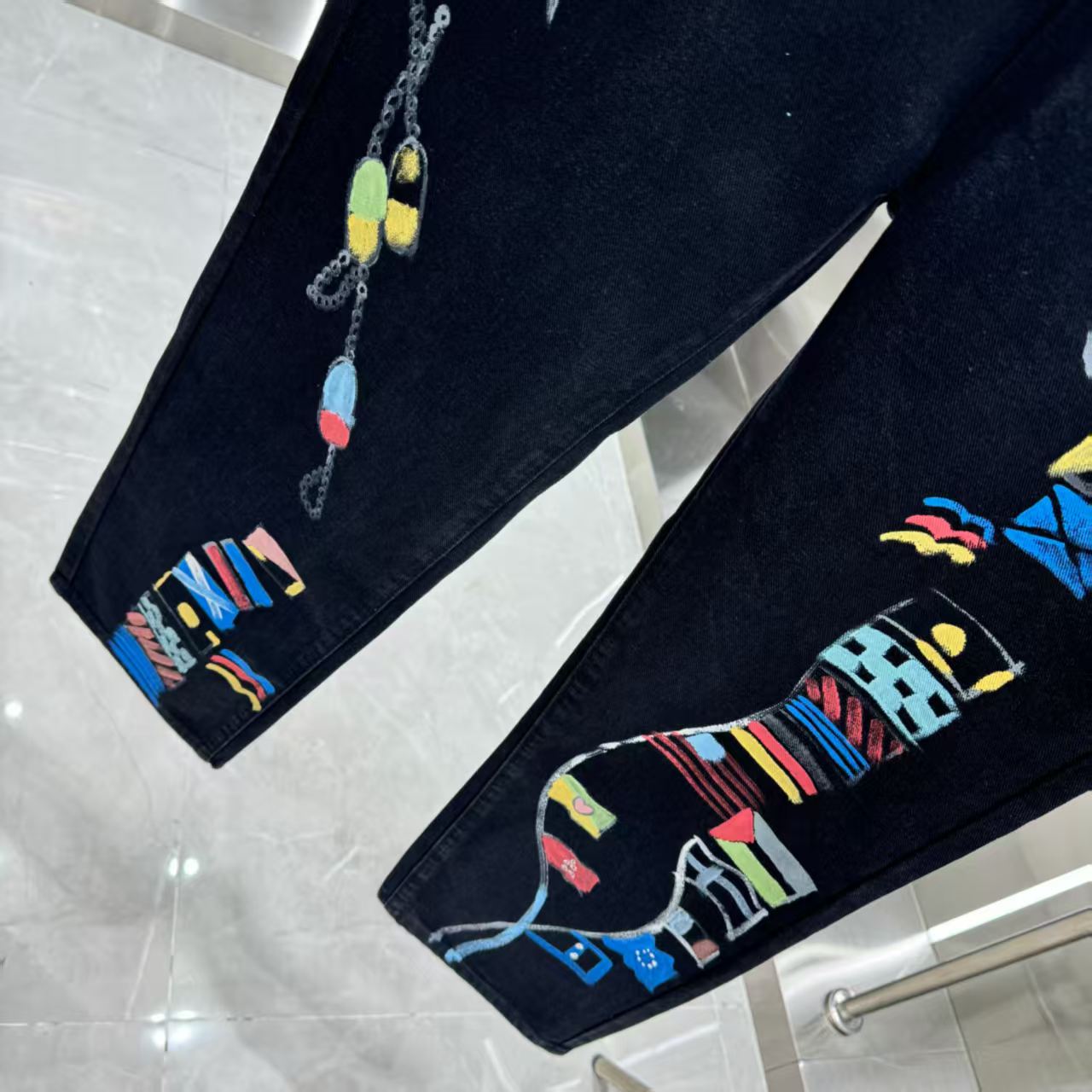 Full of letters spray straight leg jeans