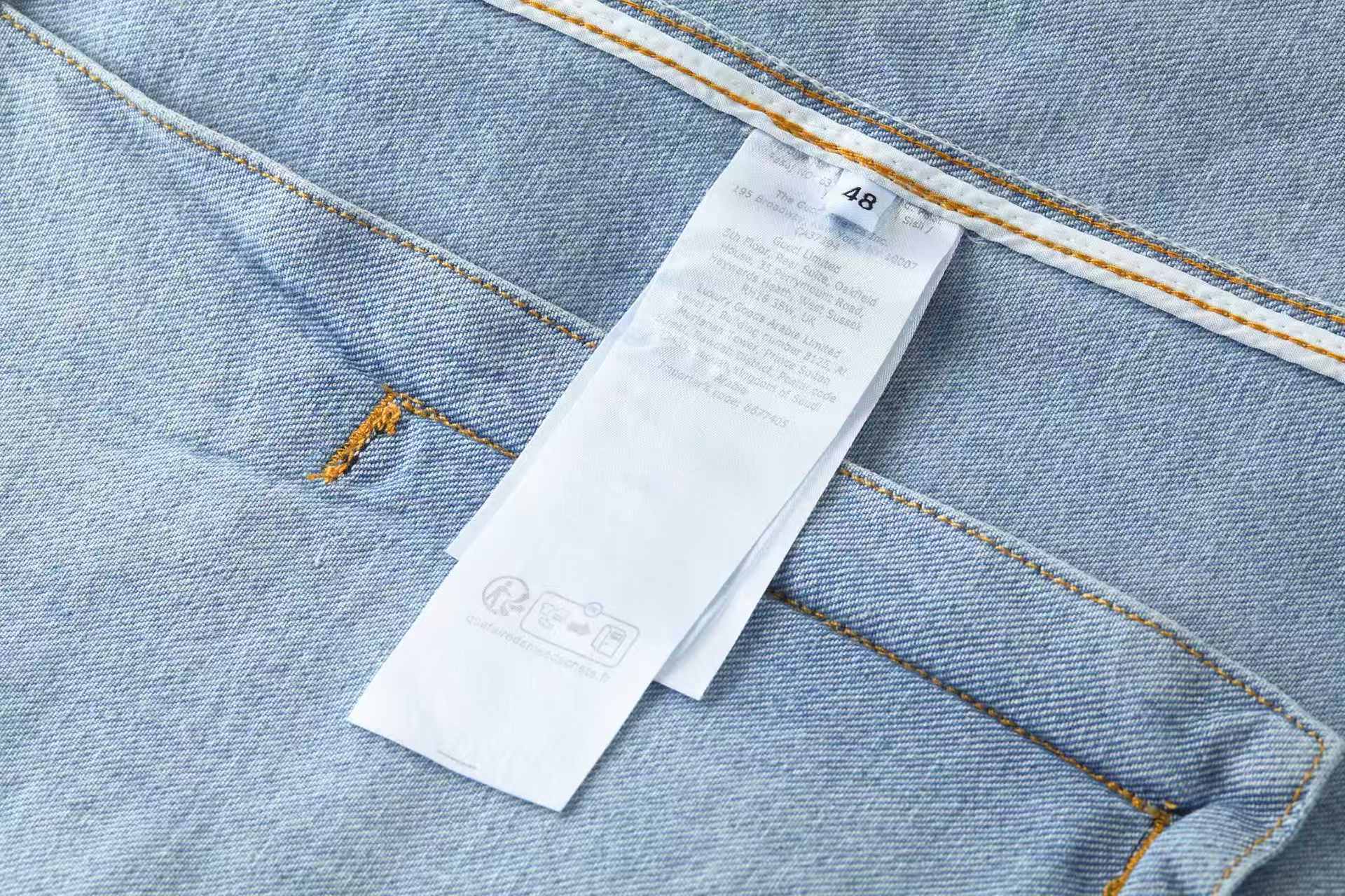 Embossed icon washed denim jacket
