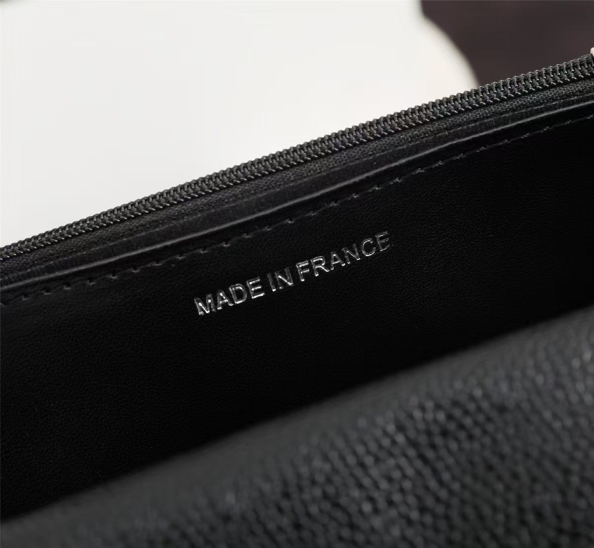 Particle embossed chain bag
