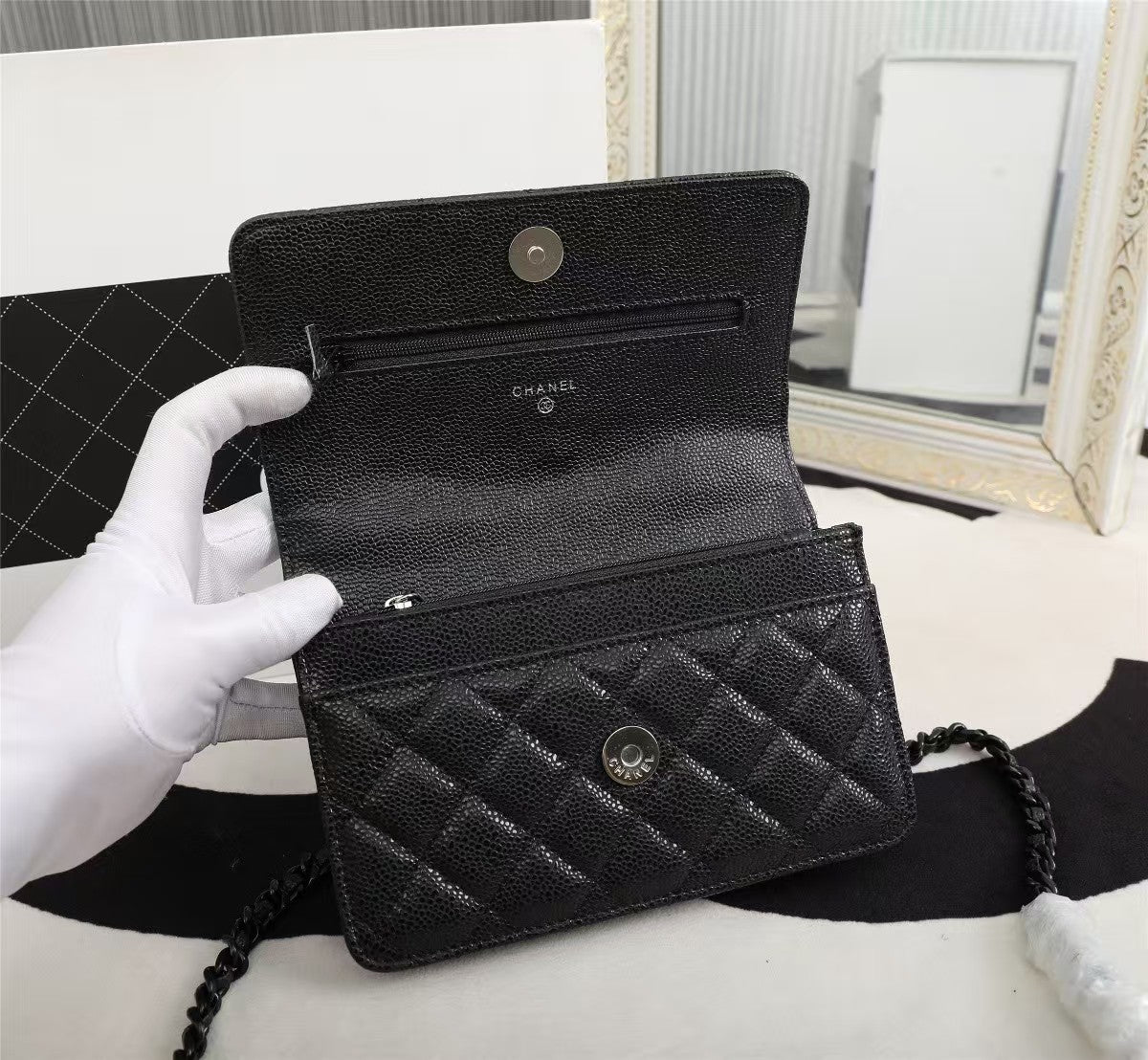Particle embossed chain bag