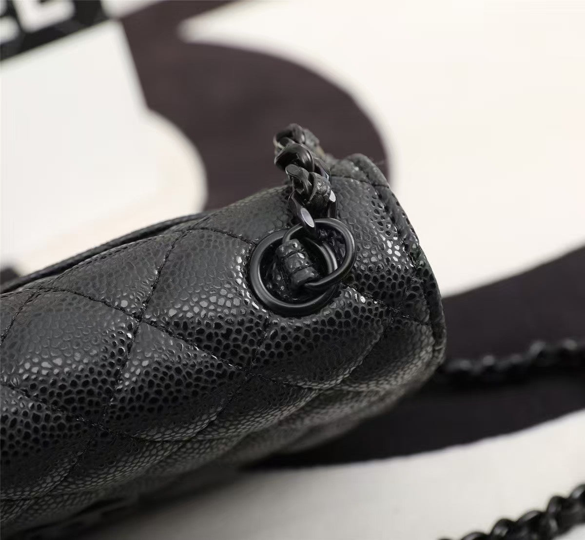 Particle embossed chain bag