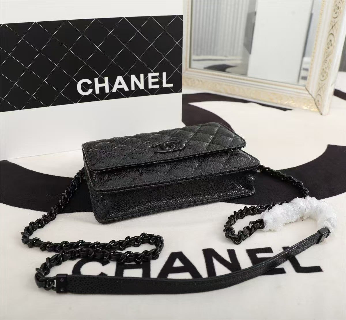 Particle embossed chain bag