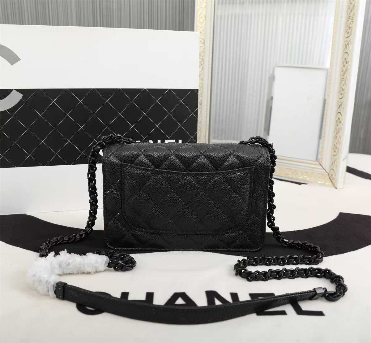 Particle embossed chain bag