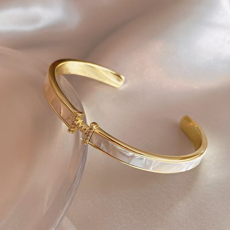 Letter opening bracelet
