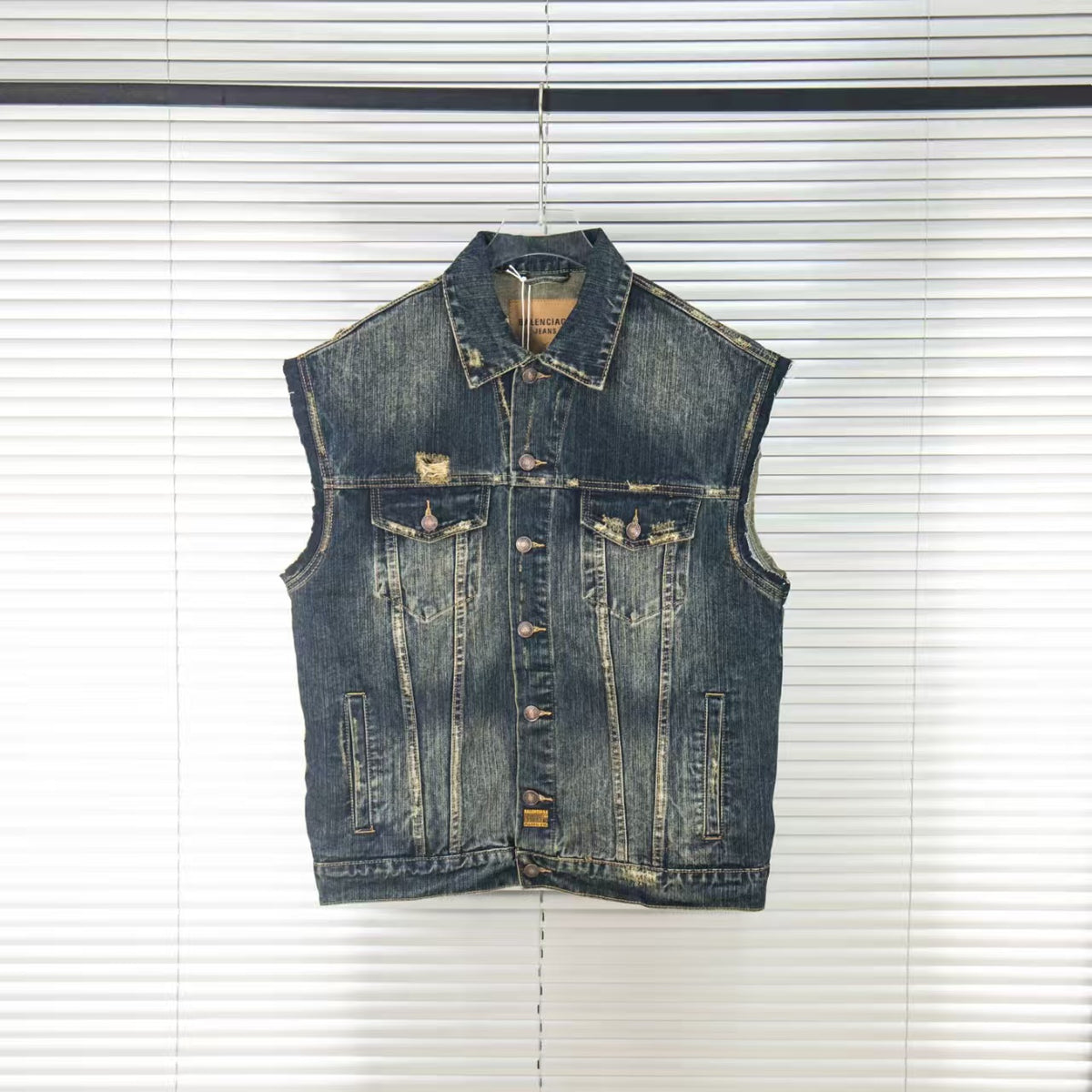Wear and tear denim vest jacket with holes