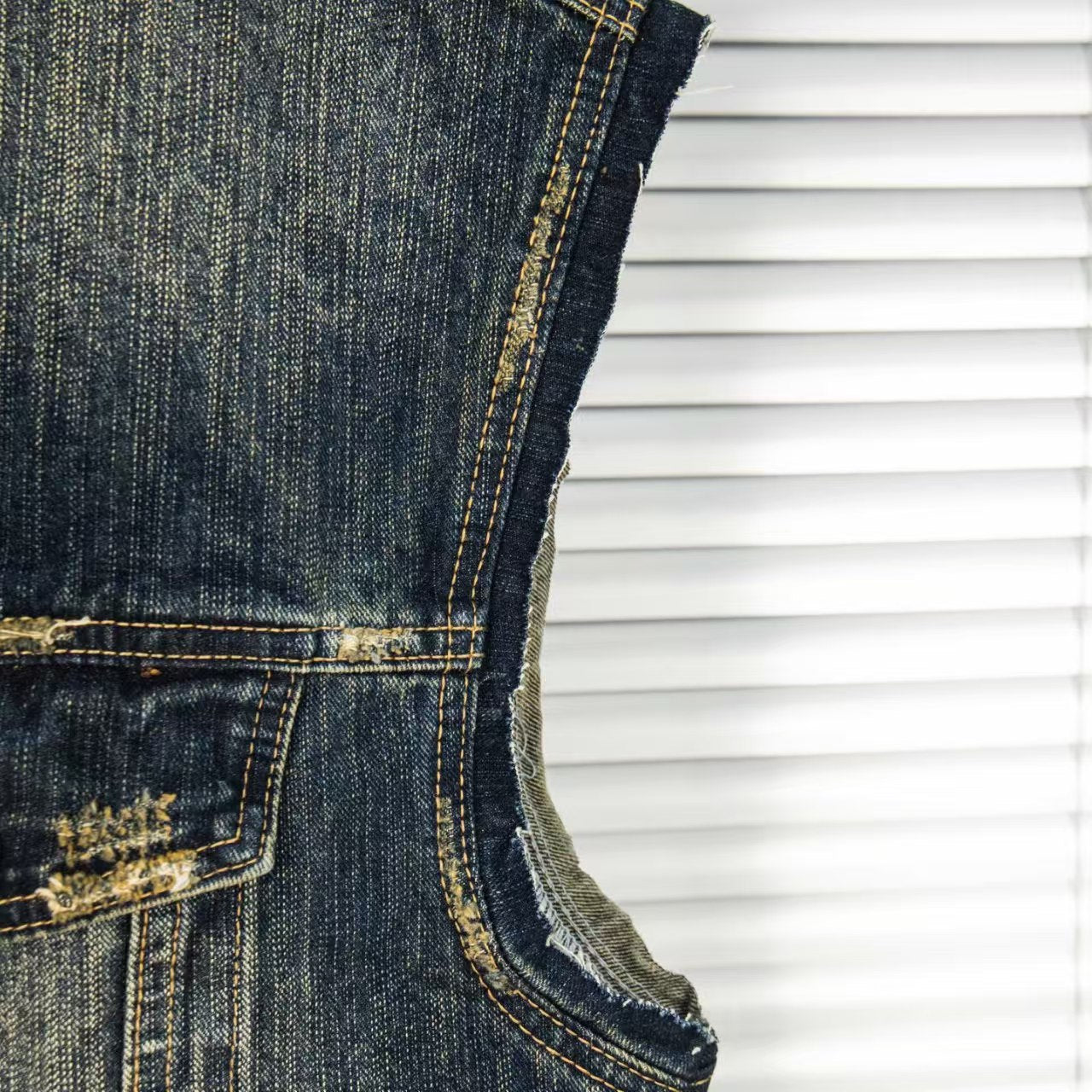 Wear and tear denim vest jacket with holes