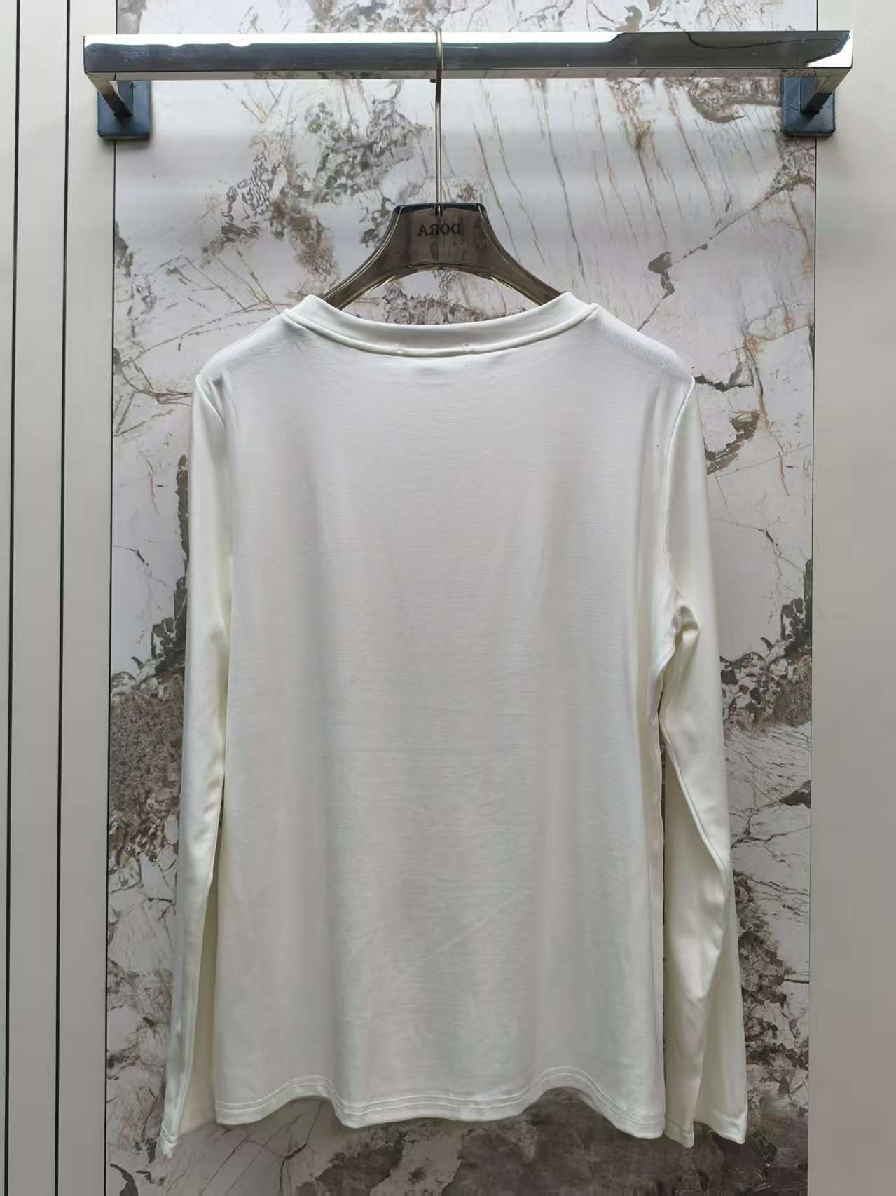 Embroidered round neck long sleeved top
