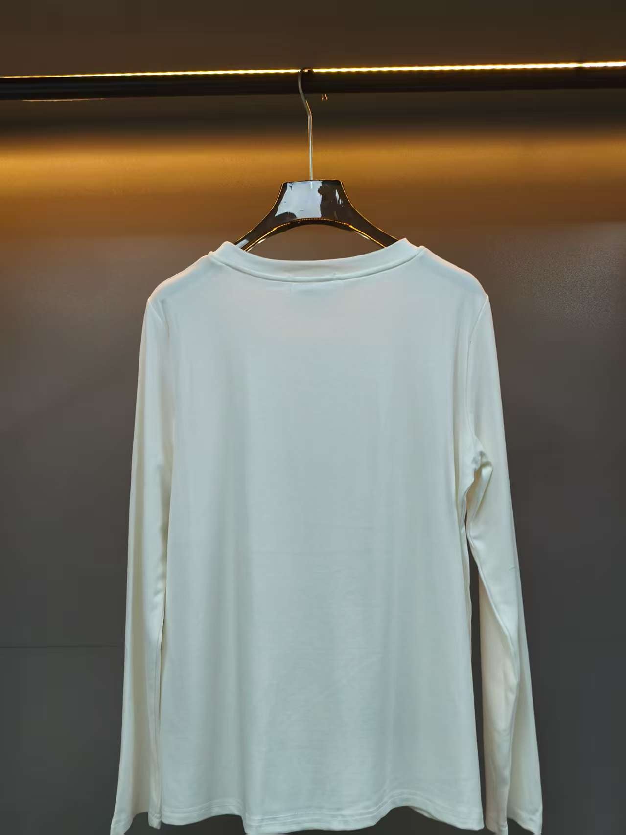 Embroidered round neck long sleeved top