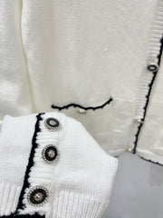 Black border contrasting pocket round neck cardigan
