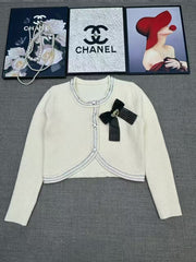 Short knit long sleeved cardigan