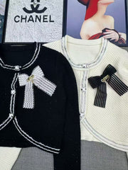 Short knit long sleeved cardigan