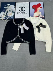 Short knit long sleeved cardigan