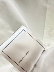 The new heavyweight is a short white shirt decorated with rhinestones