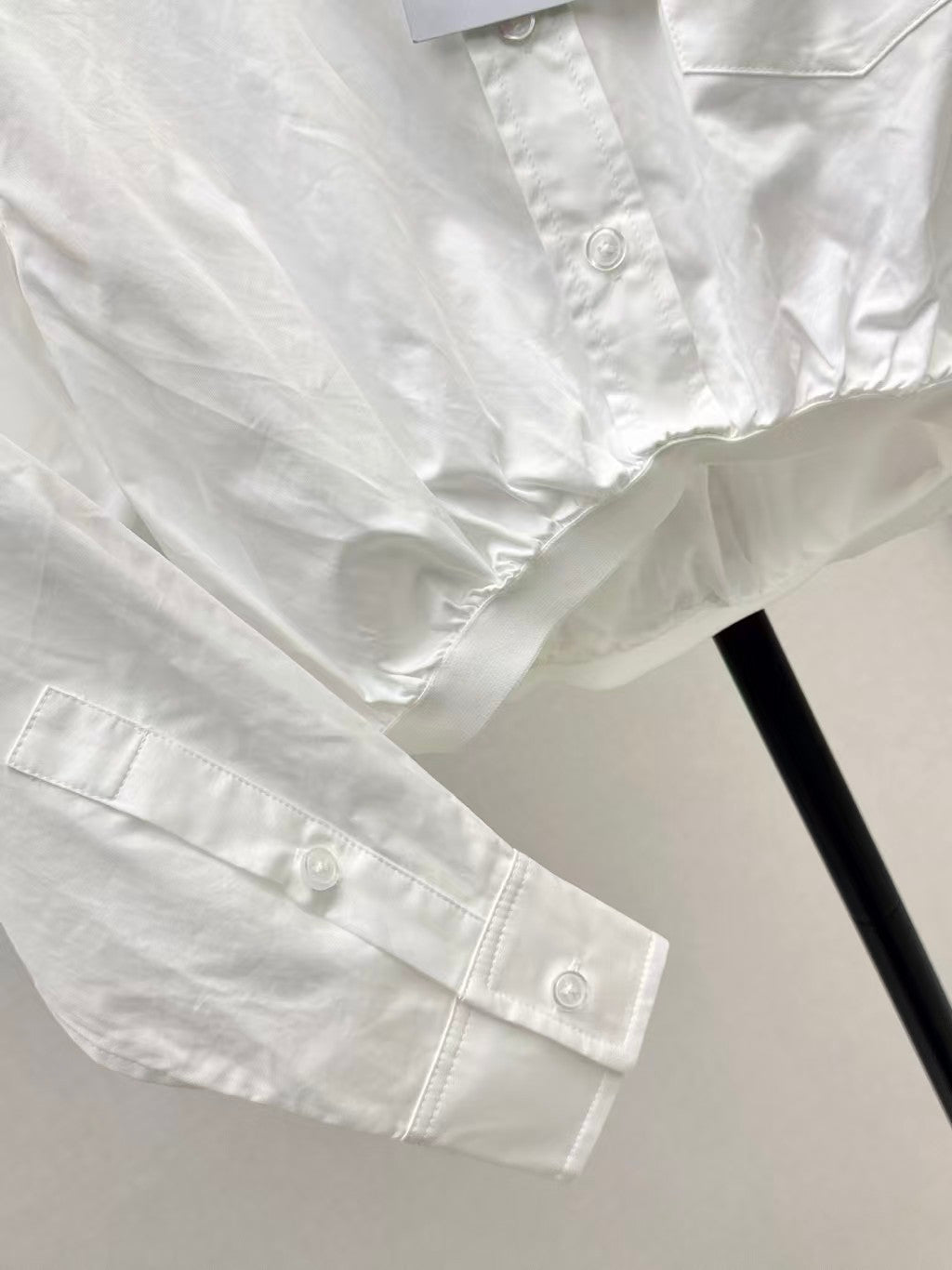 The new heavyweight is a short white shirt decorated with rhinestones