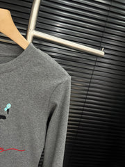 Embroidered cat lace design with cotton base and long sleeves