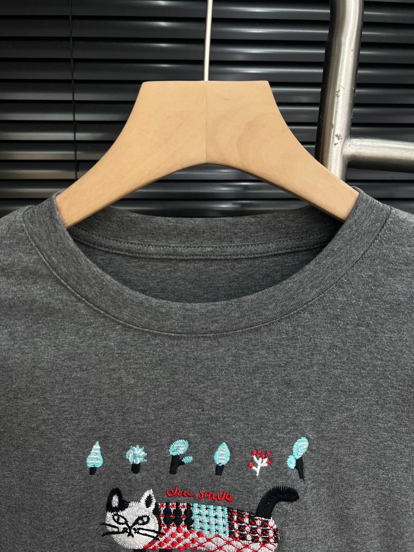 Embroidered cat lace design with cotton base and long sleeves