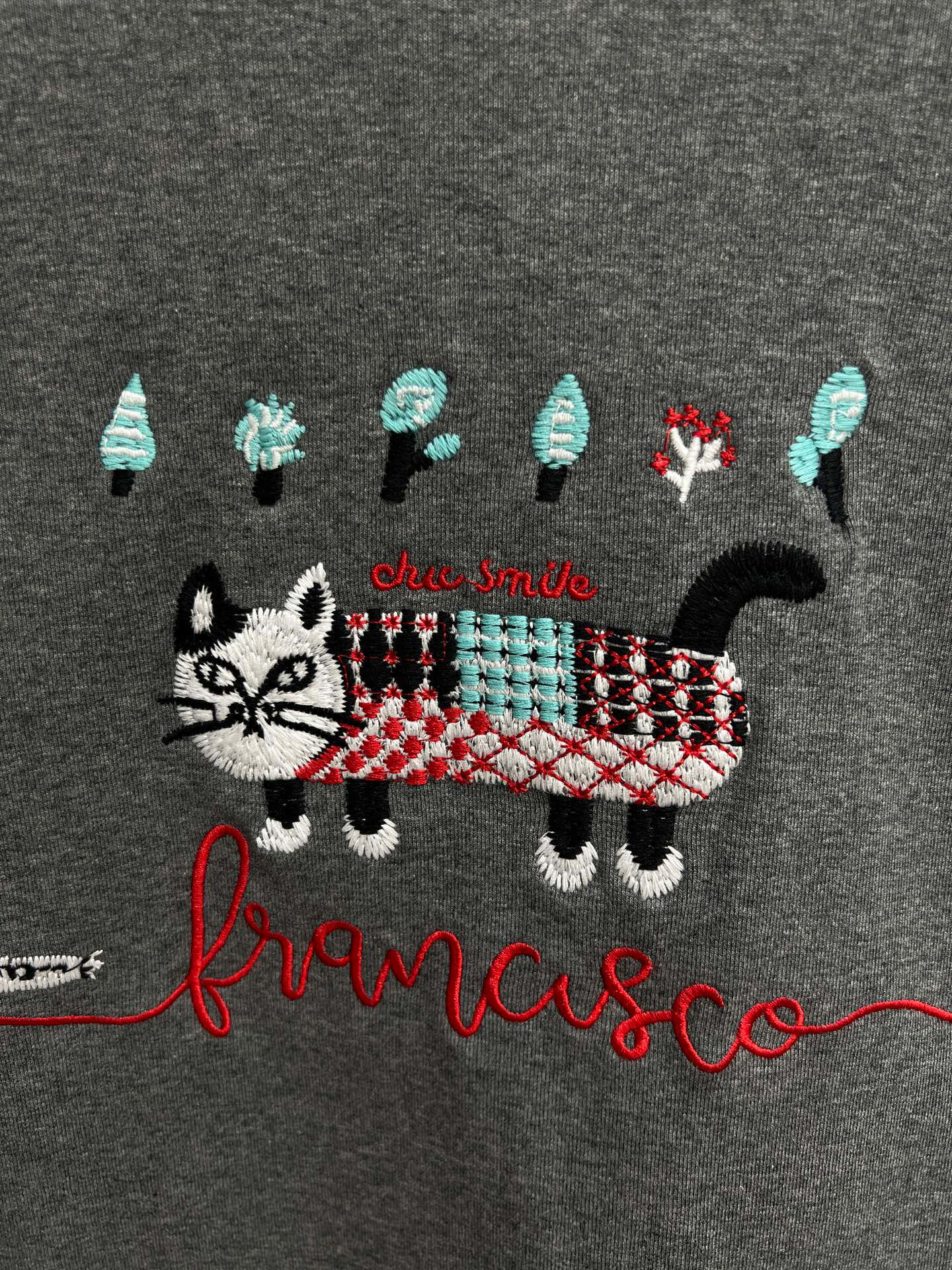 Embroidered cat lace design with cotton base and long sleeves