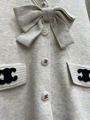 Gentle knitted cardigan with bow tie